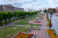 Small fountains with beautiful flower beds on Lenin Square on a summer day