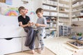 Khabarovsk, Russia, June 4, 2022. Two male kid playing Lego pieces on floor at childish room Royalty Free Stock Photo