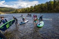 KHABAROVSK, RUSSIA - September 20, 2019 : Water tourists paddle SUP Stand up paddle board on the mountain river Anyui