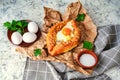 khachapuri Adjara traditional Georgian cuisine meal. Baked bread with cheese and egg filling. National pastry snack