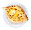 khachapuri in adjarian style with egg on plate