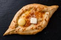 khachapuri with cheese and egg on a plate