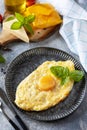 Khachapuri, Georgian cuisine meal. Baked cottage cheese pumpkin bread with cheese and egg filling on stone background. Healthy