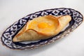 Khachapuri meal oriental plate with egg Uzbek dishes