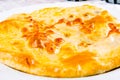 Khachapuri with meat on white plate