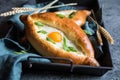 Khachapuri - Georgian cheese and egg filled bread Royalty Free Stock Photo