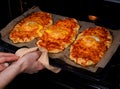 Khachapuri. A traditional Georgian dish with cheese, cottage cheese and eggs. Bakery products. A woman takes a dish out of the