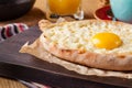 Khachapuri - traditional tortillas with eggs of Georgian cuisine. Served with spices instead of bread. Eastern food Royalty Free Stock Photo