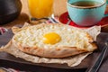 Khachapuri - traditional tortillas with eggs of Georgian cuisine. Served with spices instead of bread. Eastern food Royalty Free Stock Photo