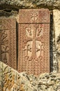 Khachkar carved in the 12th century and mounted on the wall of the cave Church, on the territory of Geghard monastery in the moun