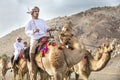 Omani men with their camels in a countryside Royalty Free Stock Photo