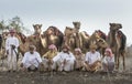 Omani men with their camels Royalty Free Stock Photo