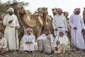 Omani men with their camels before a race Royalty Free Stock Photo