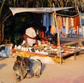 Souvenir street vendor and indian sacred cow Royalty Free Stock Photo