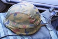 khaki Old Military Helmet. Soldier helmet. Camouflage military protective clothes.