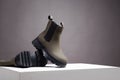 Khaki Trendy boots. fashion female shoes still life