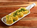 Khaman Dhokla made up of rice or urad dal is a popular breakfast or Snacks recipe from Gujarat, India, served with Green chutney Royalty Free Stock Photo
