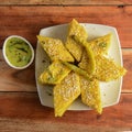 Khaman Dhokla made up of rice or urad dal is a popular breakfast or Snacks recipe from Gujarat, India, served with Green chutney Royalty Free Stock Photo