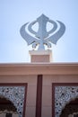 Khanda Sikh holy religious symbol at gurudwara entrance with bright blue sky image is taken at Sis Ganj Sahib Gurudwara in Chandni