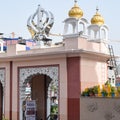 Khanda Sikh holy religious symbol at gurudwara entrance with bright blue sky image is taken at Sis Ganj Sahib Gurudwara in Chandni