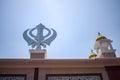 Khanda Sikh holy religious symbol at gurudwara entrance with bright blue sky image is taken at Sis Ganj Sahib Gurudwara in Chandni