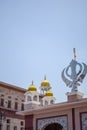 Khanda Sikh holy religious symbol at gurudwara entrance with bright blue sky image is taken at Sis Ganj Sahib Gurudwara in Chandni