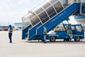 Khanh Hoa, Vietnam - July 30, 2016: Vietnam Airlines stairs ready for passenger to step down, with aviation service staffs in Cam