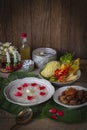 Khao-Chae, Cooked Rice Soaked in Iced Water in the white bowl and Eaten with the Usual Complementary Food and to decorate by