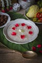 Khao-Chae, Cooked Rice Soaked in Iced Water in the white bowl and Eaten with the Usual Complementary Food and to decorate by Royalty Free Stock Photo