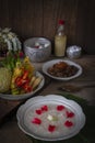 Khao-Chae, Cooked Rice Soaked in Iced Water in the white bowl and Eaten with the Usual Complementary Food and to decorate by Royalty Free Stock Photo