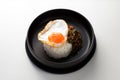 Rice topped with stir-fried pork and basil and a fried egg