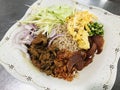 Khao kluk kapi or Fried rice with shrimp paste served with sweetened pork belly in Thailand. Royalty Free Stock Photo