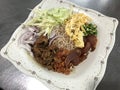 Khao kluk kapi or Fried rice with shrimp paste served with sweetened pork belly in Thailand.