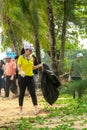 Khao Lak, Thailand, 1 june 2019: Asian kids Teens schoolchildren and boy scouts volunteers, girls and boys, clean up