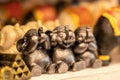 Khao Lak, Thailand, June 25, 2019: three toy elephant sitting with their eyes closed. toy souvenir from the store for