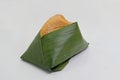 Khao niao sangkhaya, sticky rice with coconut custard wrapped with banana leaves, a popular Thai dessert