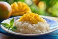 Khao Niew Mamuang or Thai mango sticky rice with coconut cream