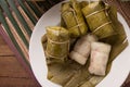 Khao tom mad Thai food style dessert, made from banana and glutinous rice, wrap with banana leaf on wooden table Royalty Free Stock Photo