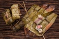Khao Tom Mat - Thai dessert - Sticky Rice, Banana and Black Beans Wrapped in Banana leaf