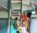 Indian folk singer performs in a local train Royalty Free Stock Photo