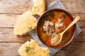 Kharcho soup in a bowl served with Georgian bread close-up. horizontal top view