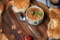 Kharcho soup with lamb meat served in a clay bowl with lavash flatbread