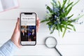 KHARKIV, UKRAINE - April 10, 2019: Apple iPhone X in female hand with nytimes.com site on the screen Royalty Free Stock Photo