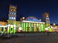 Kharkiv, Ukraine - April 5, 2015: Railway station and square. Evening city. Illumination of beautiful architecture Royalty Free Stock Photo