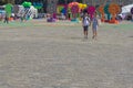 Kharkiv, Ukraine, August 2019 Fair on city central square. Couple of man and woman hold by hands. People walk and enjoy fun