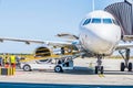 Kharkiv, Ukraine - August 19, 2018: Loading baggage on a plane. Ground staff handling an aircraft before departure