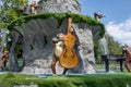 Kharkiv, Ukraine, August, 2019 Monkey music band. Ape plays on violoncello. Creative fun sculpture of animal musician. Outside