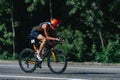 Triathlon biking man cycling on road bike at top speed on the triathlon race