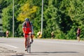 Triathlon biking man cycling on road bike at top speed on the triathlon race