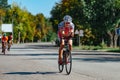 Triathlon biking man cycling on road bike at top speed on the triathlon race